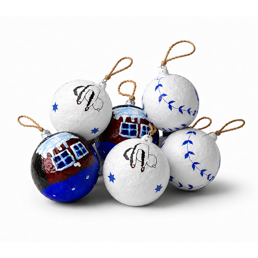 Set of handmade paper mache Christmas baubles with blue white cottage and winter designs