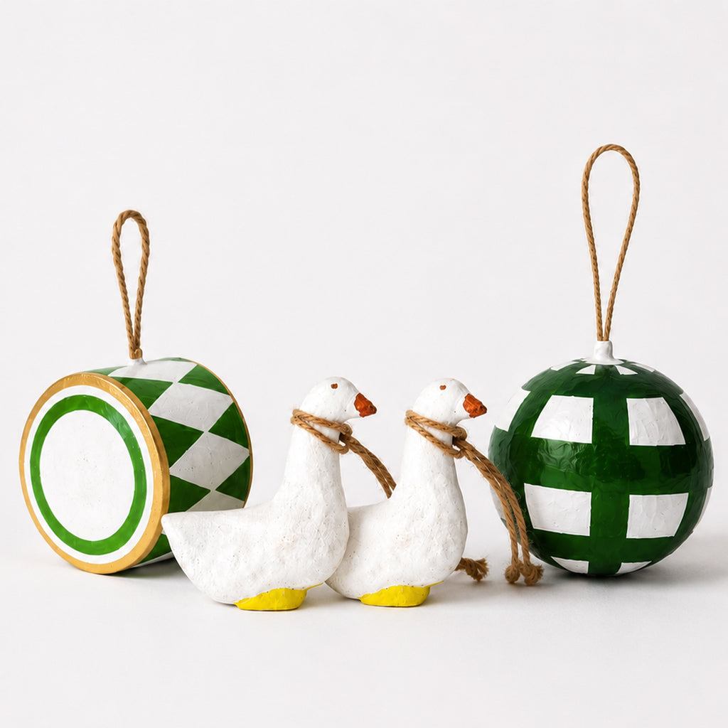 Handmade paper mache Christmas ornament set with two white goose figurines, green harlequin drum and checkered bauble — jute twine
