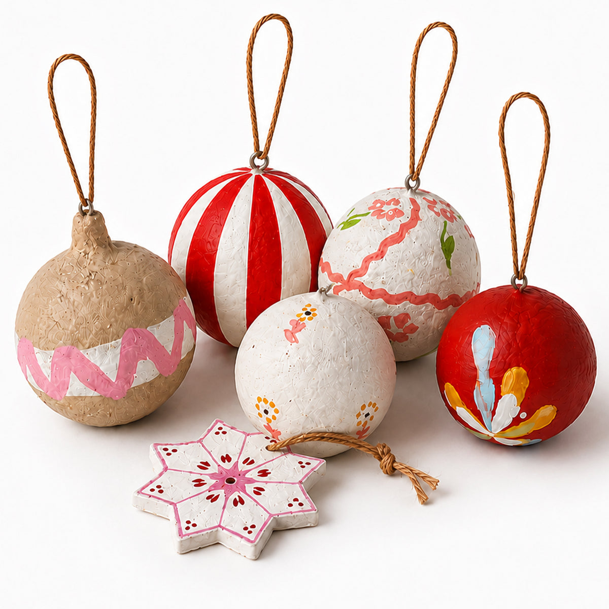 Handmade paper mâché Christmas baubles set of 6 — folk art ornaments on white background
