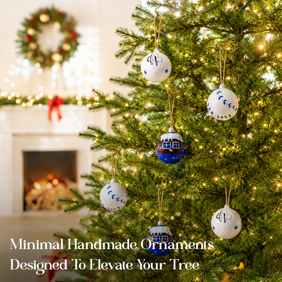 Hand painted paper mache Christmas baubles hanging on a festive tree with warm lights