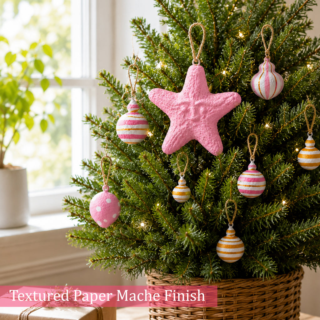 Textured paper mache Christmas ornaments in blush pink and gold tones