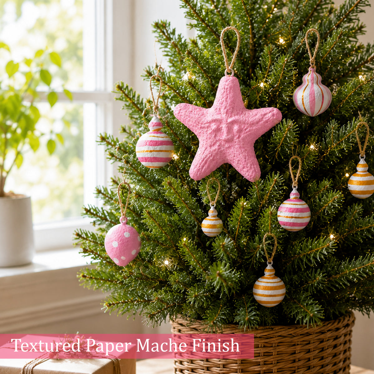Textured paper mache Christmas ornaments in blush pink and gold tones