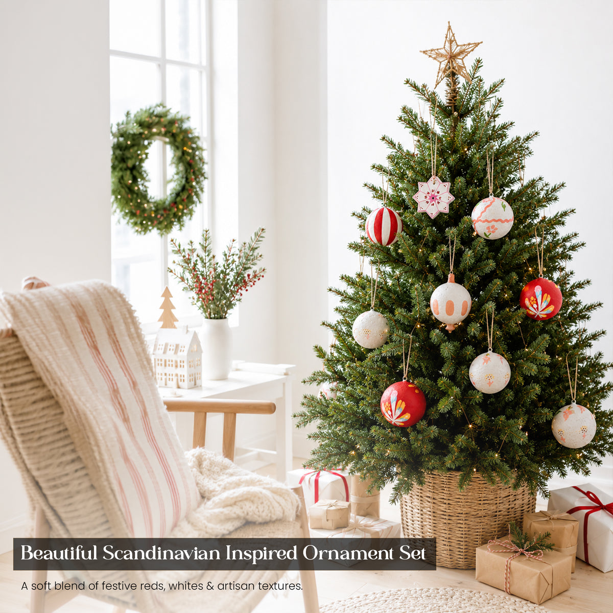 Red and white Scandinavian folk art hand-painted Christmas baubles on full Christmas tree in bright modern living room