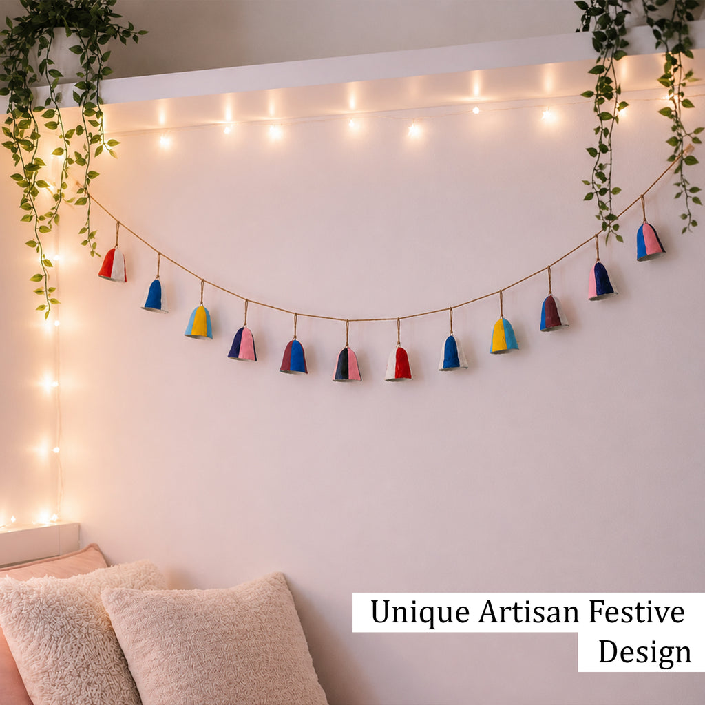 Colour block paper mache bell garland as year round bedroom wall decoration with fairy lights