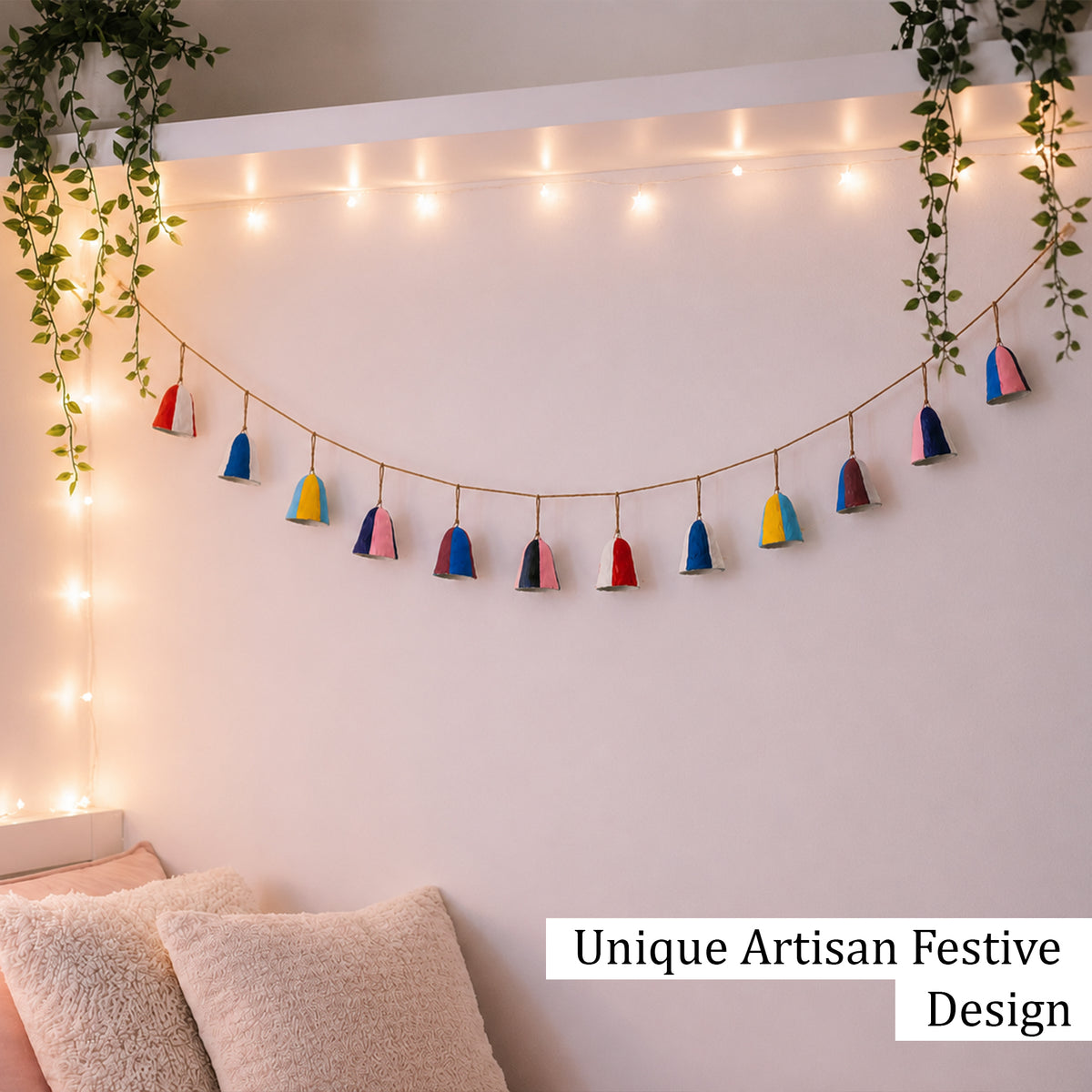 Colour block paper mache bell garland as year round bedroom wall decoration with fairy lights