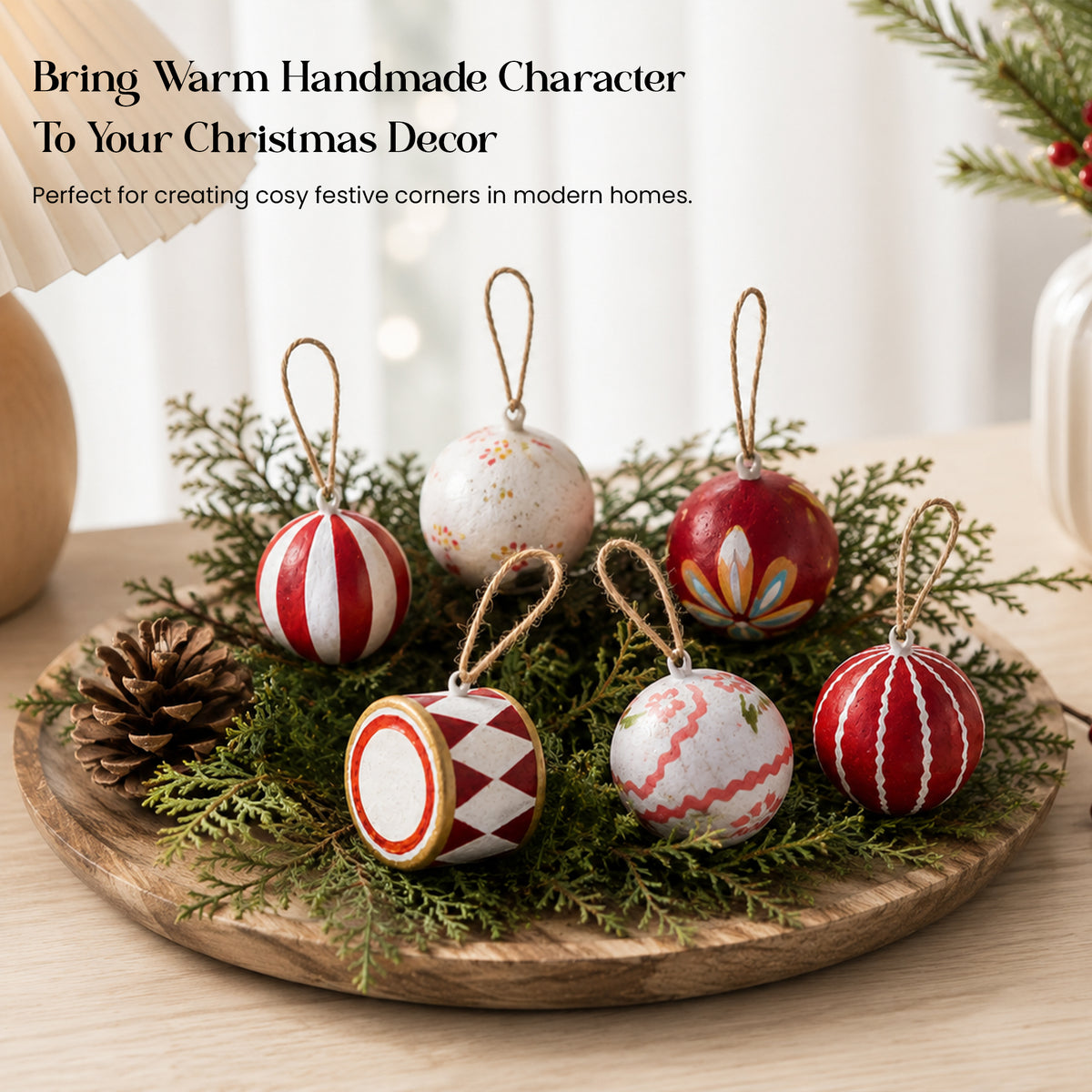 Hand painted Christmas baubles set in wooden display tray with pine cones and greenery – Aala India