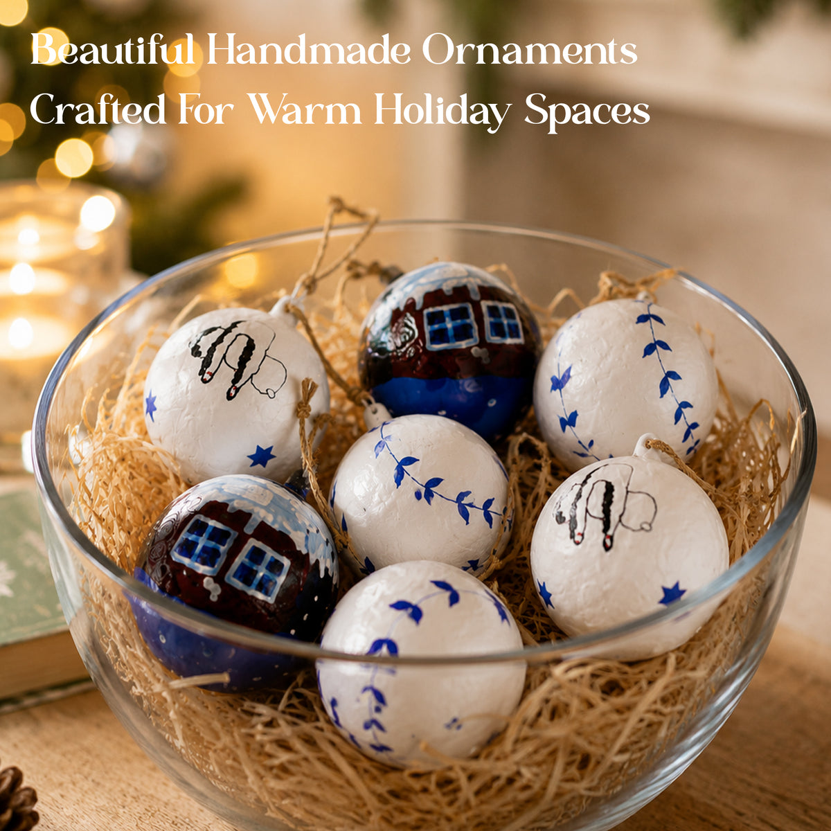 Handmade Christmas ornaments displayed in a glass bowl with festive straw styling