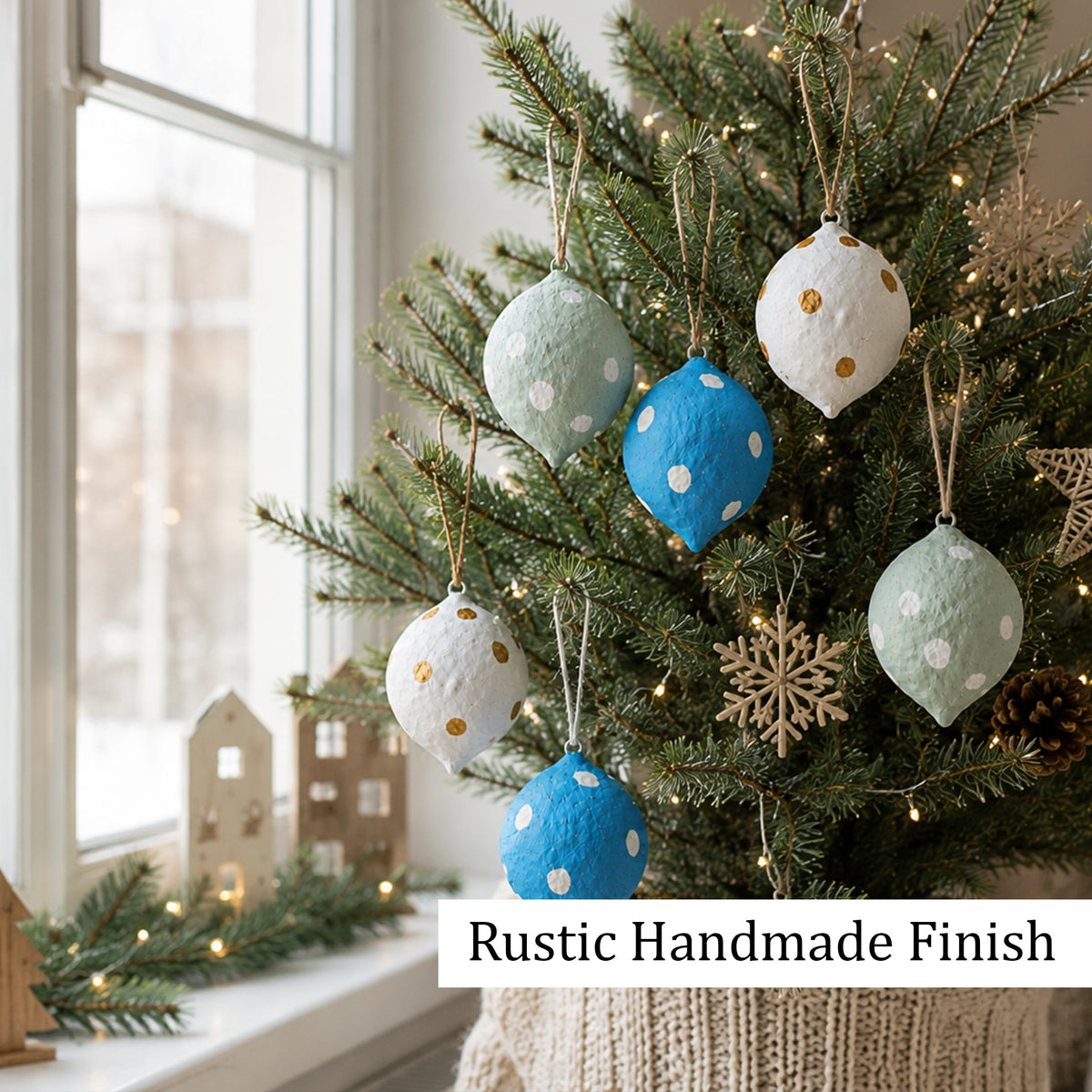 Rustic handmade finish polka dot baubles hanging on Christmas tree
