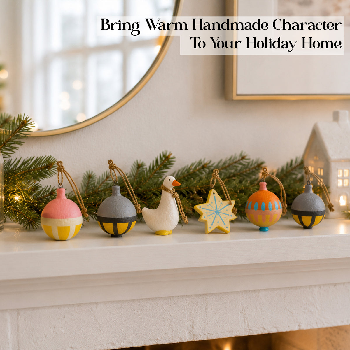 Full set of 6 handmade Scandi Christmas ornaments lined up on mantelpiece with greenery – duck figurine, star and papier mâché baubles, warm holiday decor
