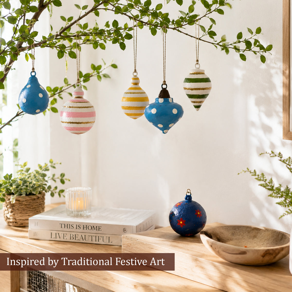Hand-painted paper mache ornaments inspired by traditional festive art