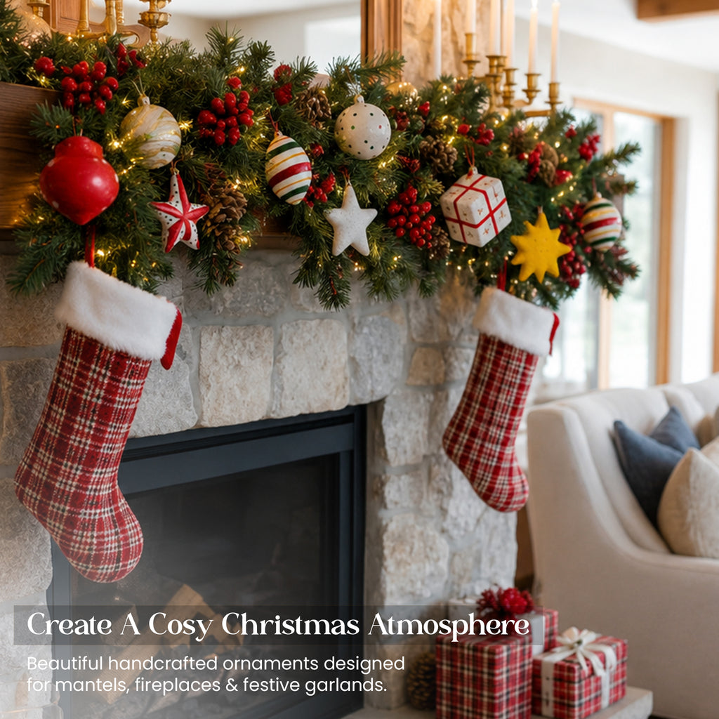 Handmade paper mache Christmas ornament set in festive mantelpiece garland with stockings stone fireplace