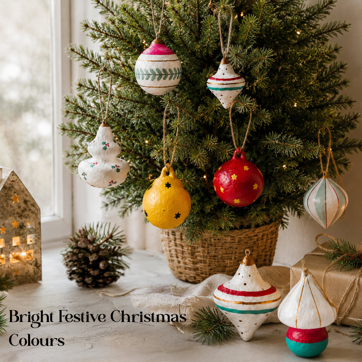 Bright colourful paper mache Christmas decorations styled in a cosy festive home