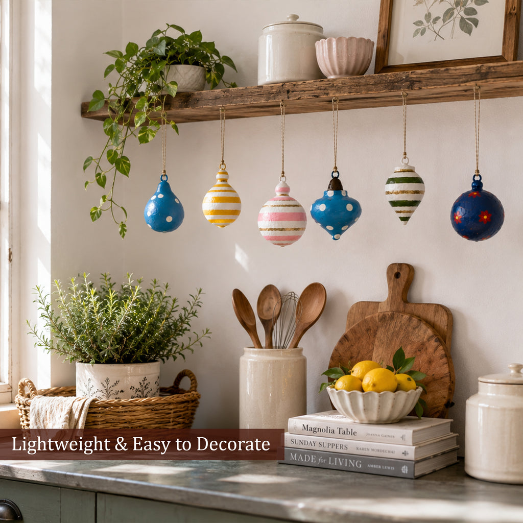 Lightweight handmade Christmas baubles hanging on kitchen shelf decor