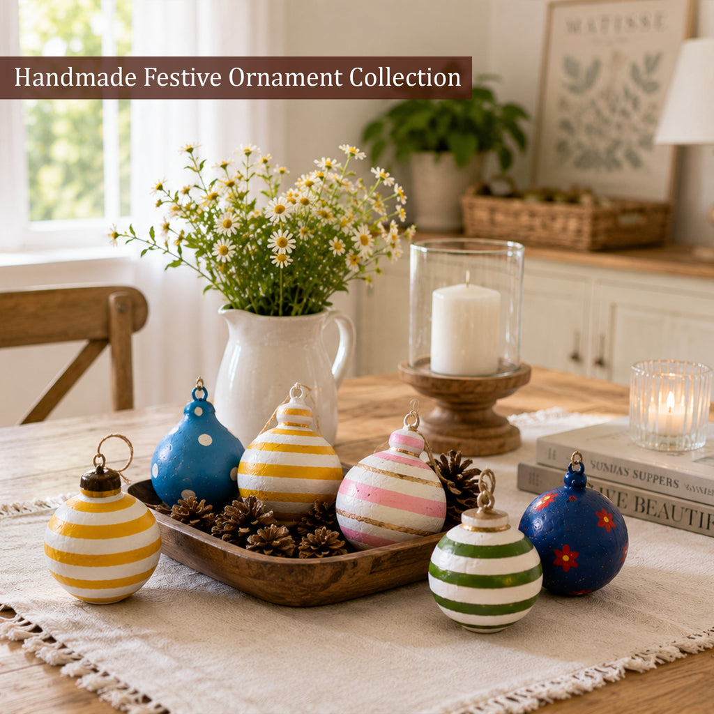 Colourful handmade festive ornament collection styled on a table