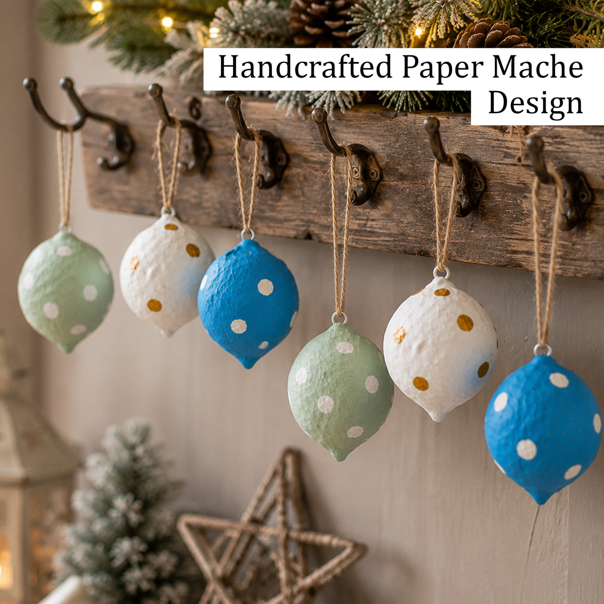 Handcrafted paper mache Christmas baubles hanging on rustic wall hooks