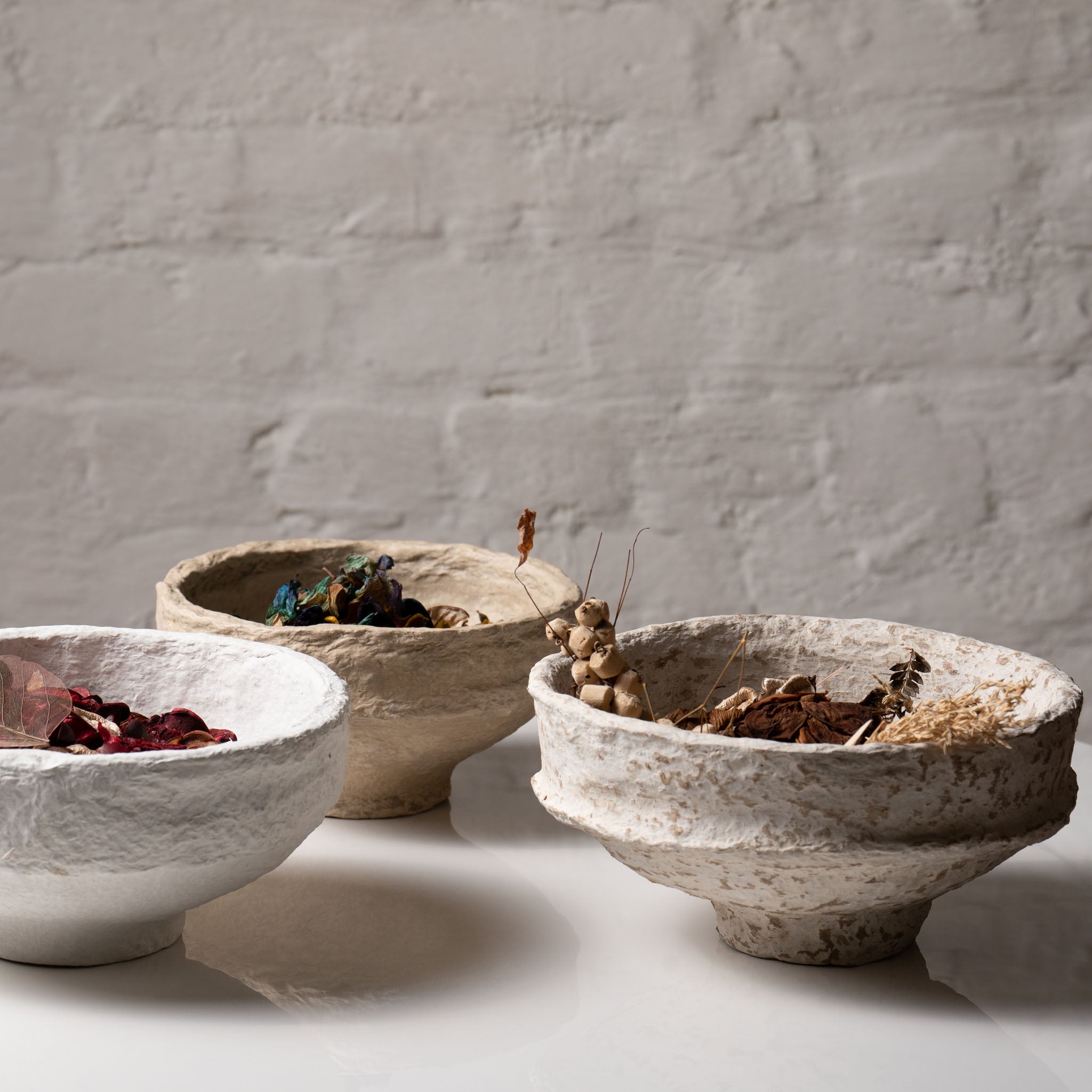 Wide decorative bowl styled with dried botanicals