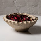 Close-up textured of handmade paper mache bowl showing natural imperfections