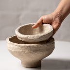 Hand holding handmade paper mache bowl showing size and texture, artisan crafted home decor