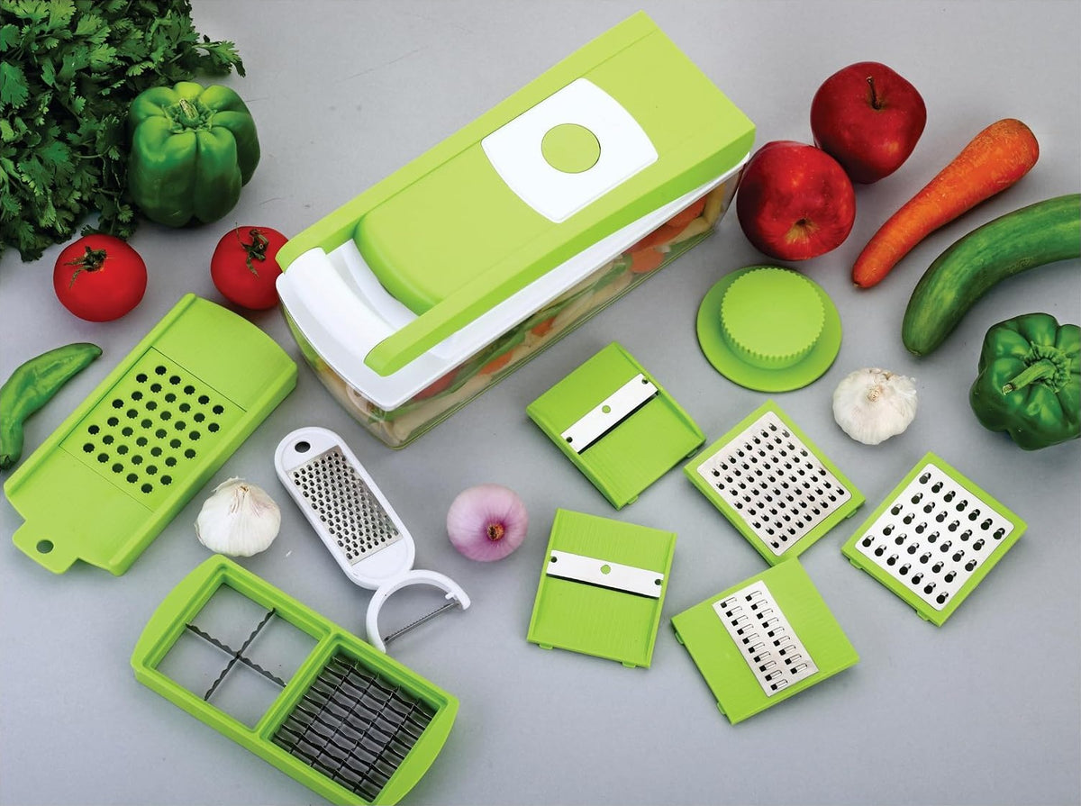Closed chopper from above, one dicing tray, slicer board holding the plastic grater, five inserts, food holder, hand grater