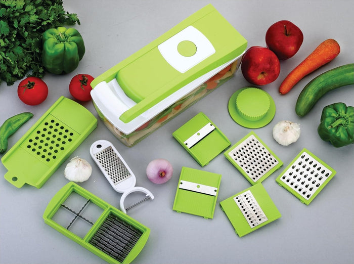 Closed chopper from above, one dicing tray, slicer board holding the plastic grater, five inserts, food holder, hand grater